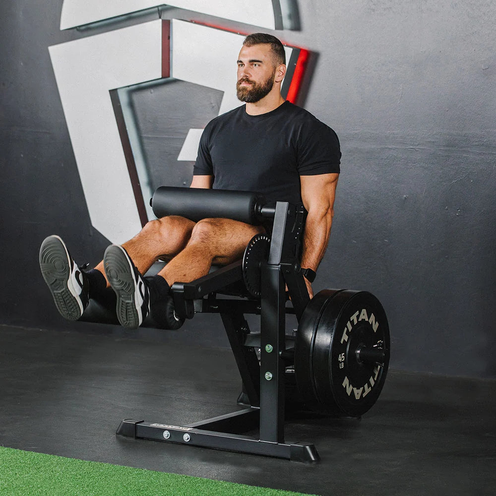 Titan plate-loaded leg extension and leg curl machine, extension position extended