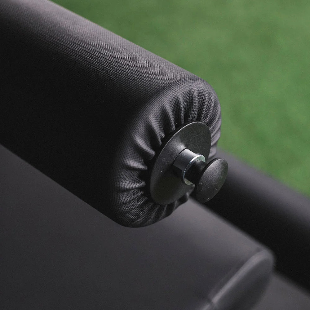 Titan plate-loaded leg extension and leg curl machine, padded roller